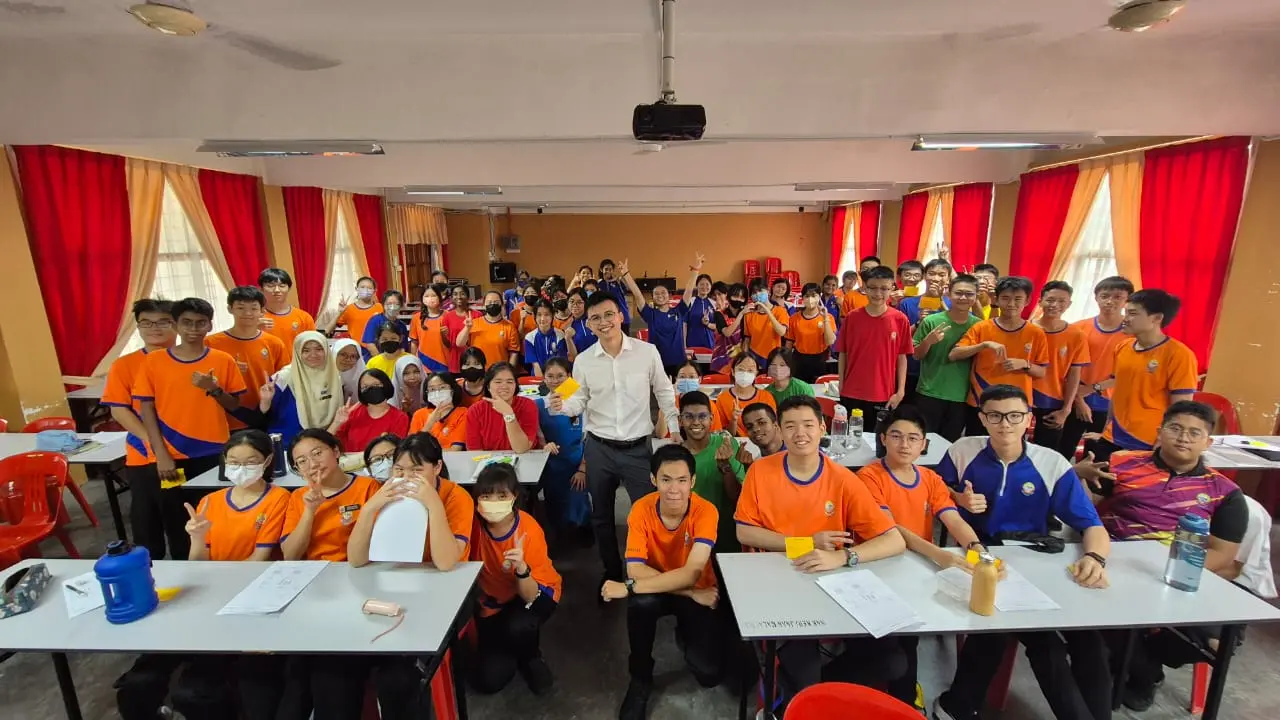 CH GOH with a group of students in a classroom